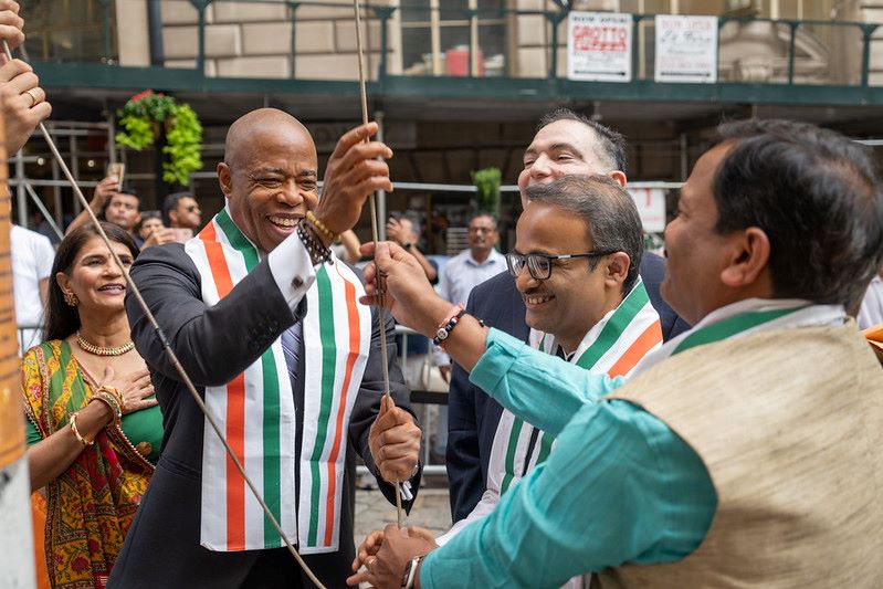 Mayor Adams hoisting the Indian flag